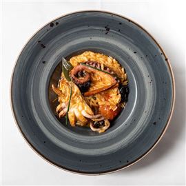 Orzo pasta ‘yiouvetsi' casserole with octopus, cuttlefish and plum